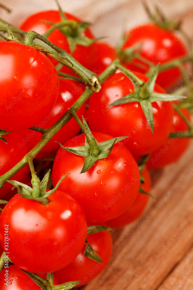 Cherry tomatoes on the wood background