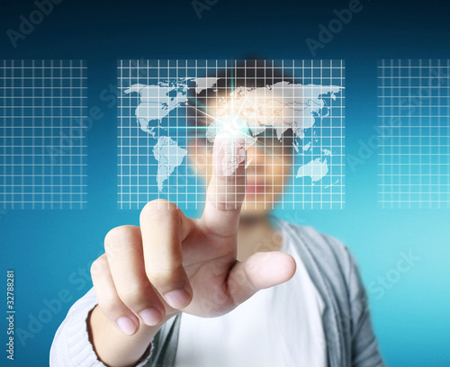 Stock Photo: hand pushing on a touch screen interfac photo