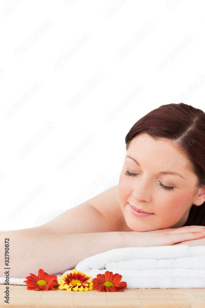 Portrait of a happy red-haired woman posing while relaxing in a Portrait of a happy red-haired woman posing while relaxing in a