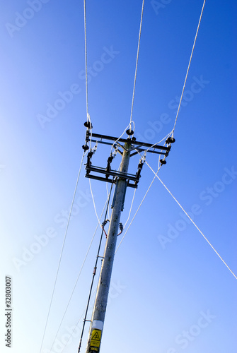 Electricity distribution pole with ice