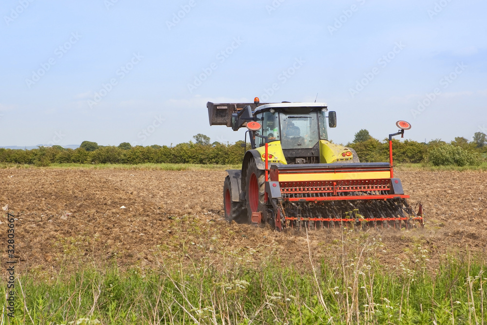 Fototapeta premium harrowing a field