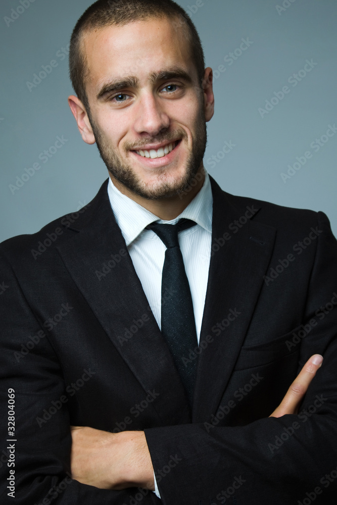 Close-up portrait of a smiling handsome young business man Close-up portrait of a smiling handsome young business man