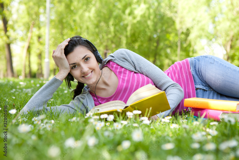 smiling woman with book in nature smiling woman with book in nature
