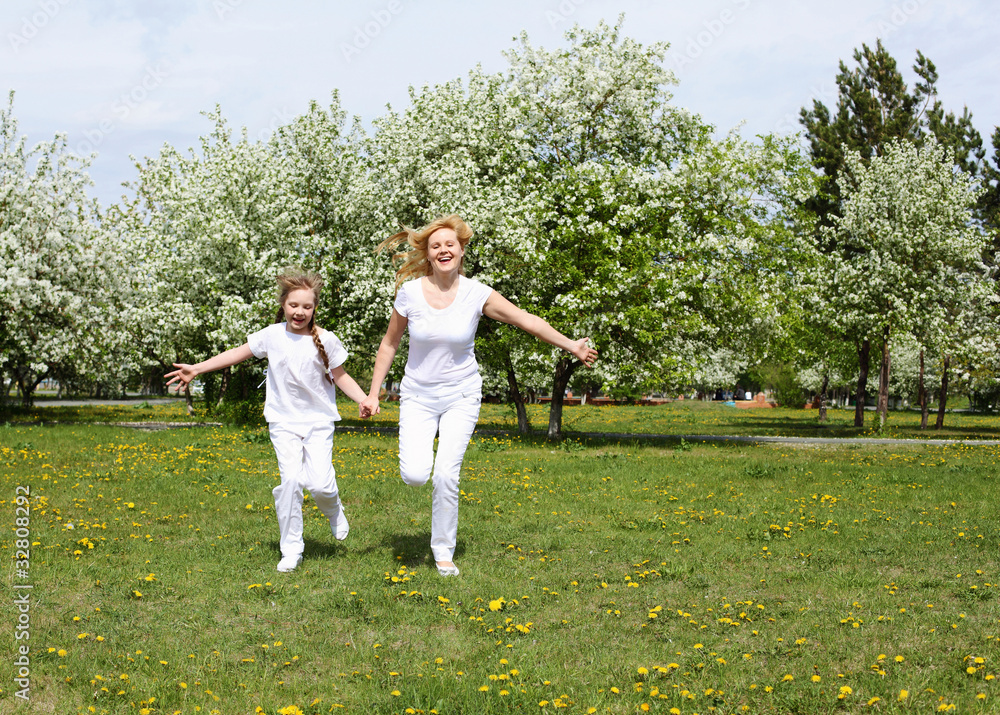 girl with mother in spring park