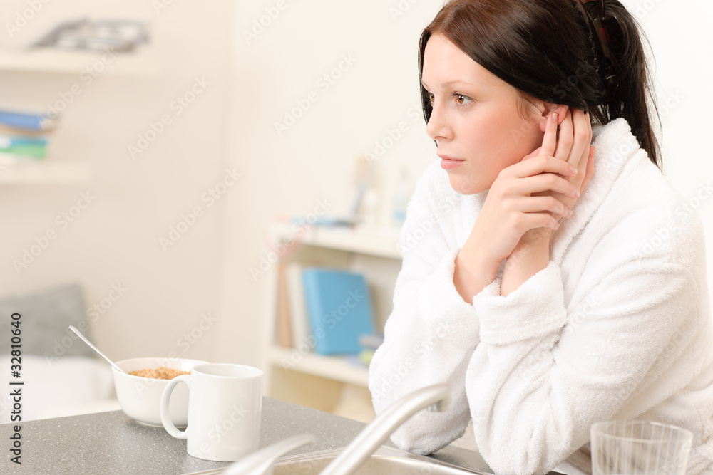 Young student girl have breakfast in kitchen Young student girl have breakfast in kitchen