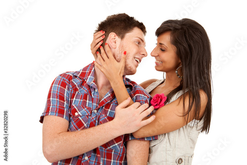 couple smiling while embracing