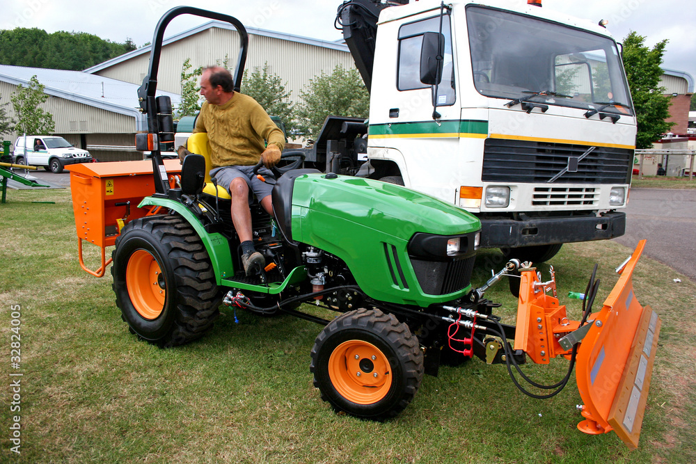 Obraz premium man driving tractor