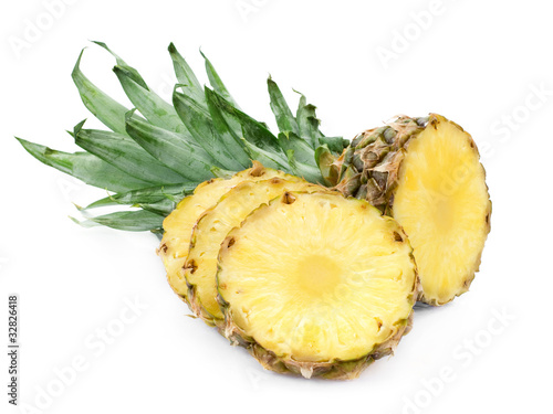 Ripe pineapple with lush green leaves
