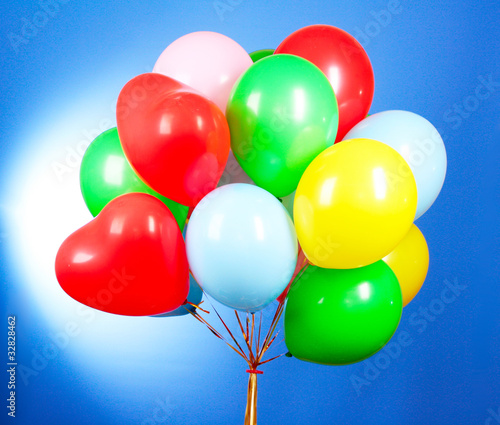 Flying balloons on a blue background