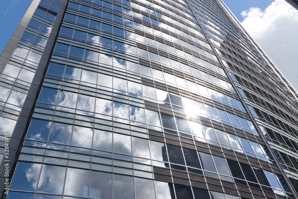 Modern building reflecting the sky and sun Modern building reflecting the sky and sun