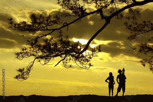 silhouette of photographer and woman. Sunrise