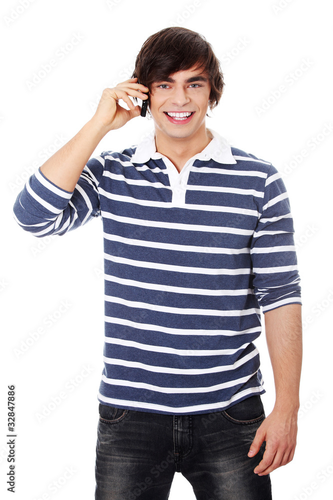 A handsome happy man using mobile phone. A handsome happy man using mobile phone.