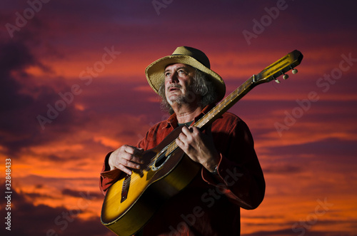 Sunset guitarist with surreal lighting