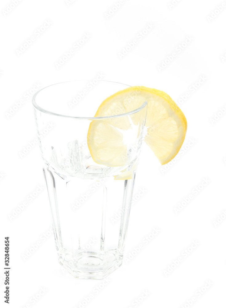 A glass of mineral water with a lemon A glass of mineral water with a lemon