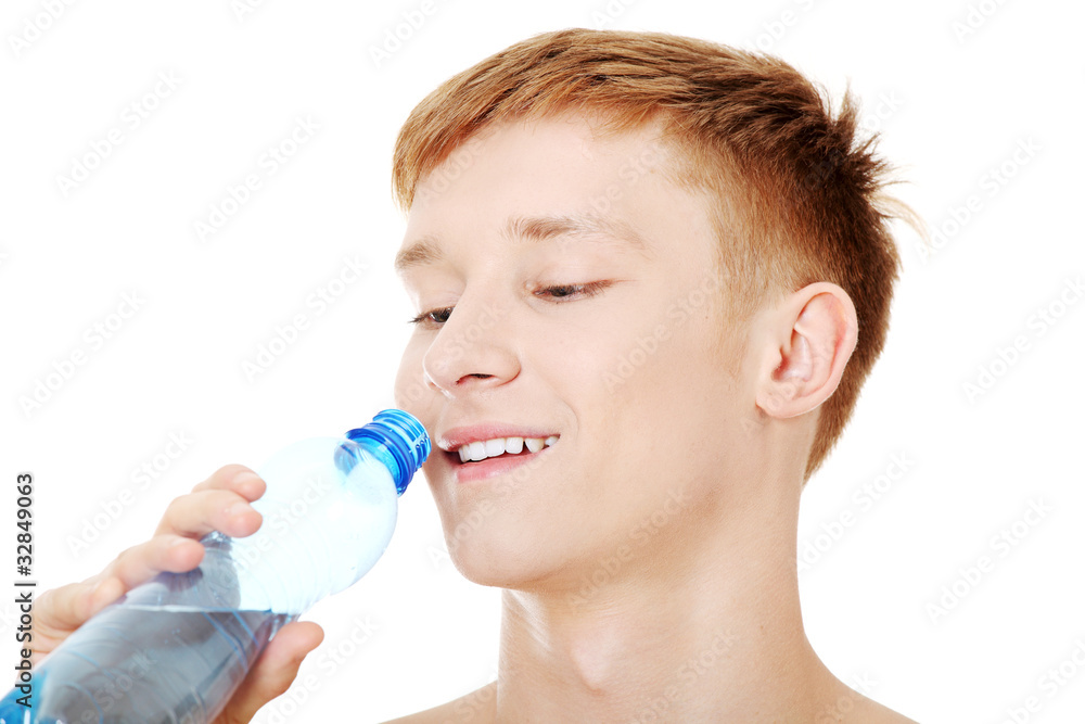 Young male drinking water Young male drinking water