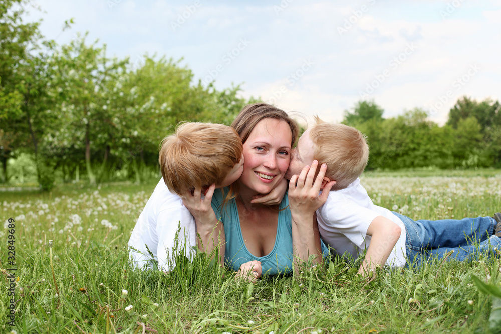 mother with her two sons outdoors mother with her two sons outdoors