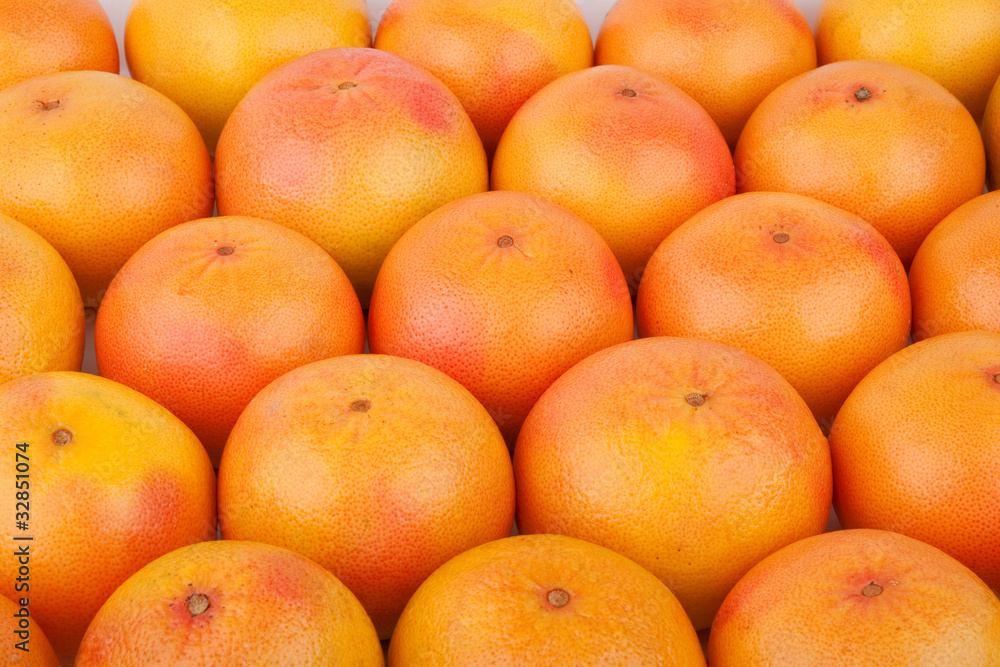 Background of many fresh grapefruits arranged Background of many fresh grapefruits arranged