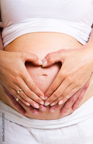 Wallpaper Mural Man and pregnant woman belly isolated on white Torontodigital.ca