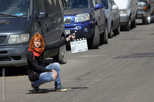 Wallpaper Mural Girl holding a movie clapper Torontodigital.ca