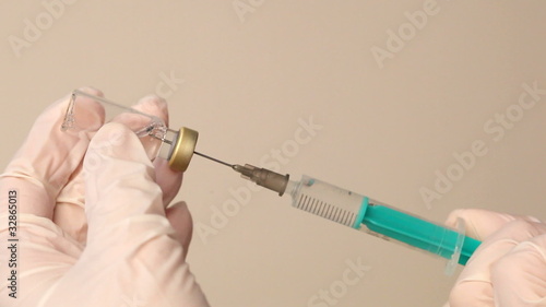 Syringe with a medicine in a hand