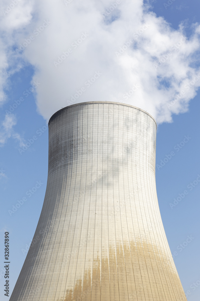 big smokestack of nuclear factory with blue sky big smokestack of nuclear factory with blue sky