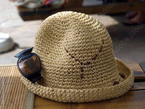 A hat and sunglasses - beach attributes photo