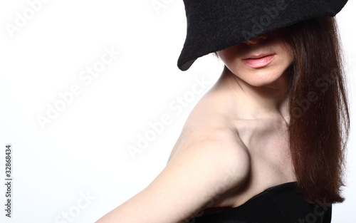 Portrait of an attractive young woman in hat