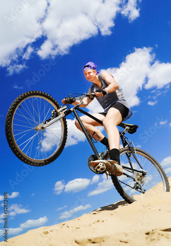 Foto Young men  riding a bike
