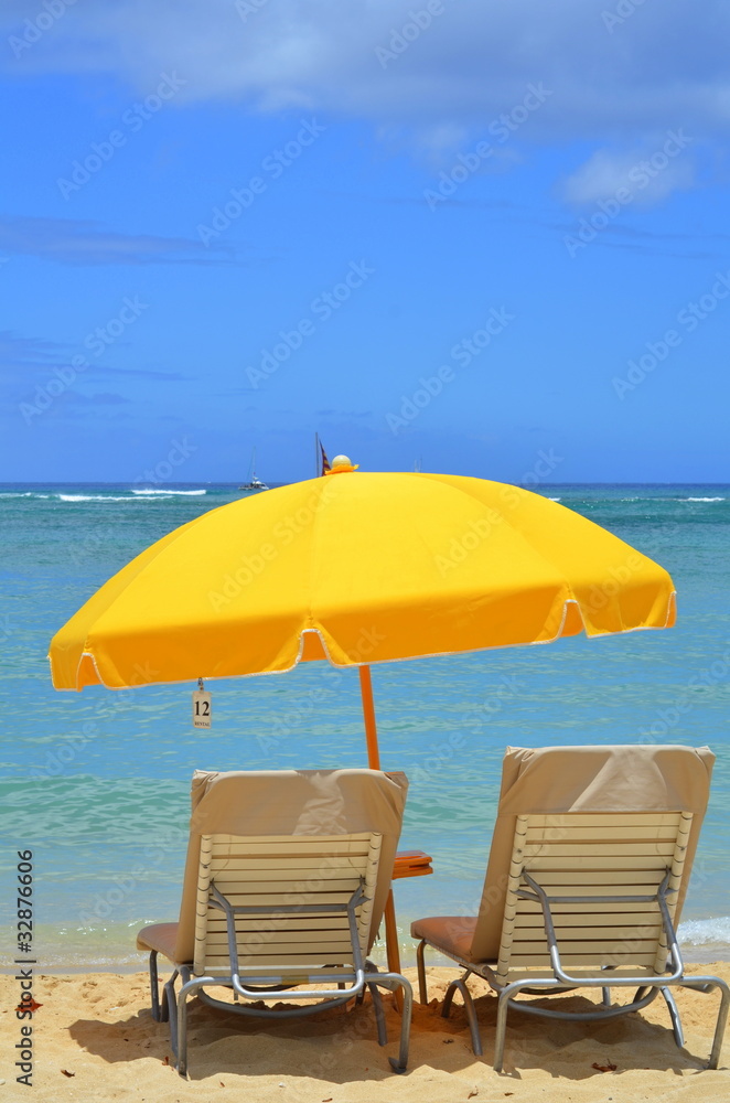 Vacation Image Of Bright Yellow Beach Umbrella And Loungers