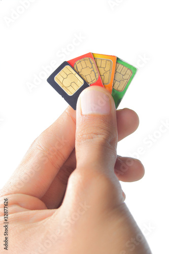 Sim card In a hand, isolated on white