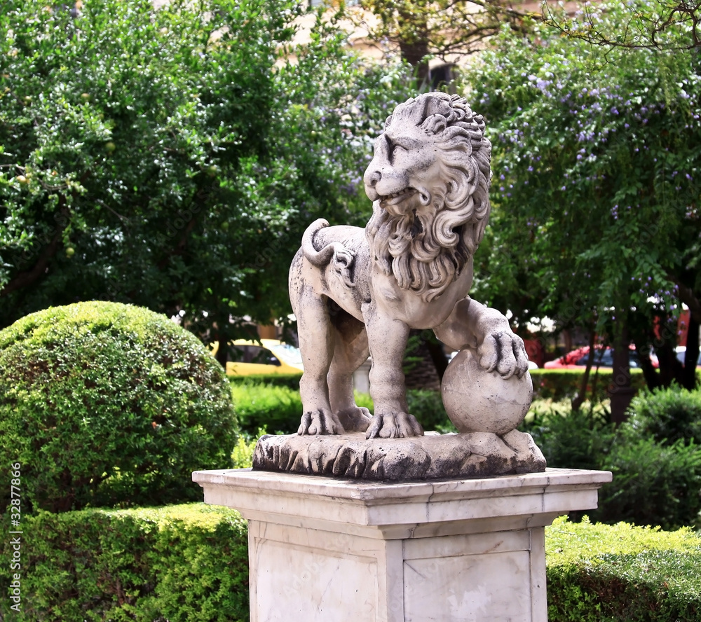 A statue of the lion in Seville park, Andalusia, Spain