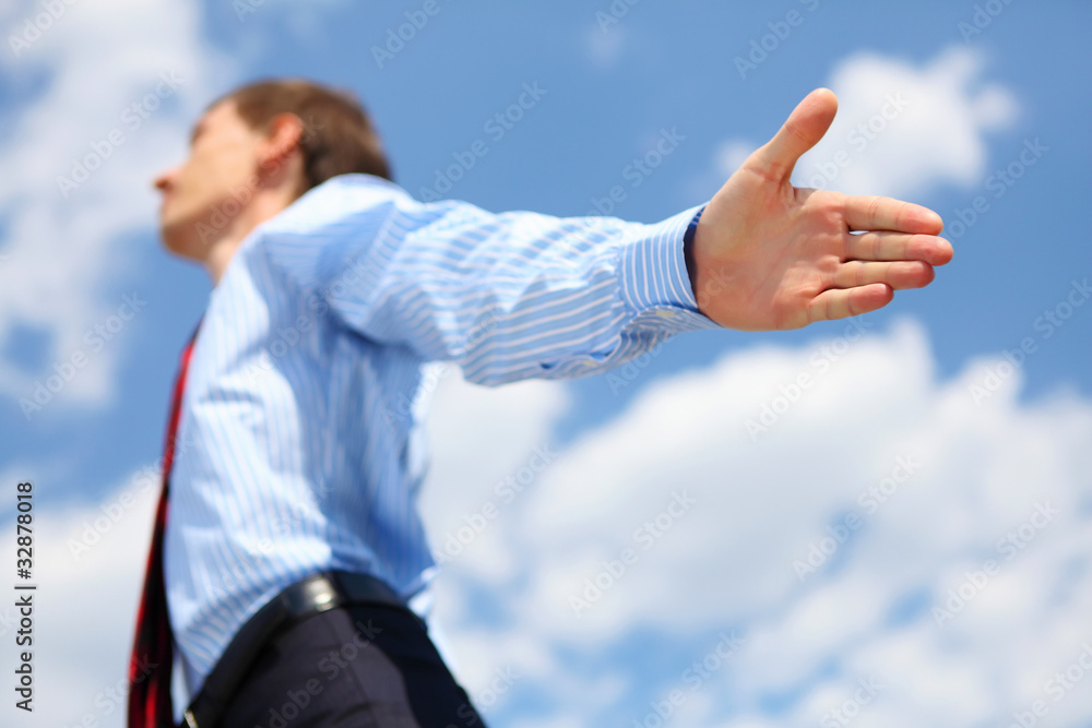 Fototapeta premium young business man in a blue shirt and red tie