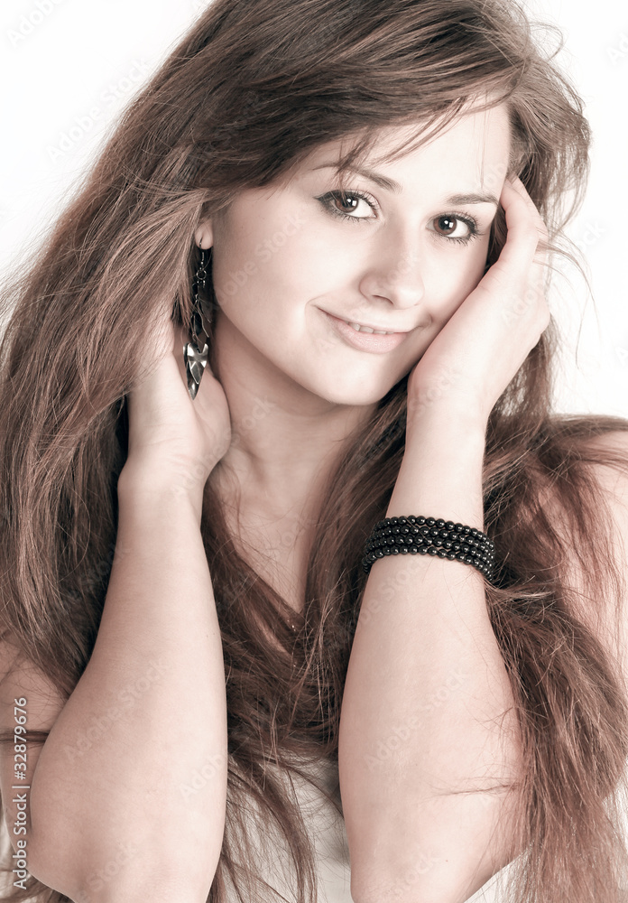 Fototapeta premium Sensual young woman with beautiful long brown hairs