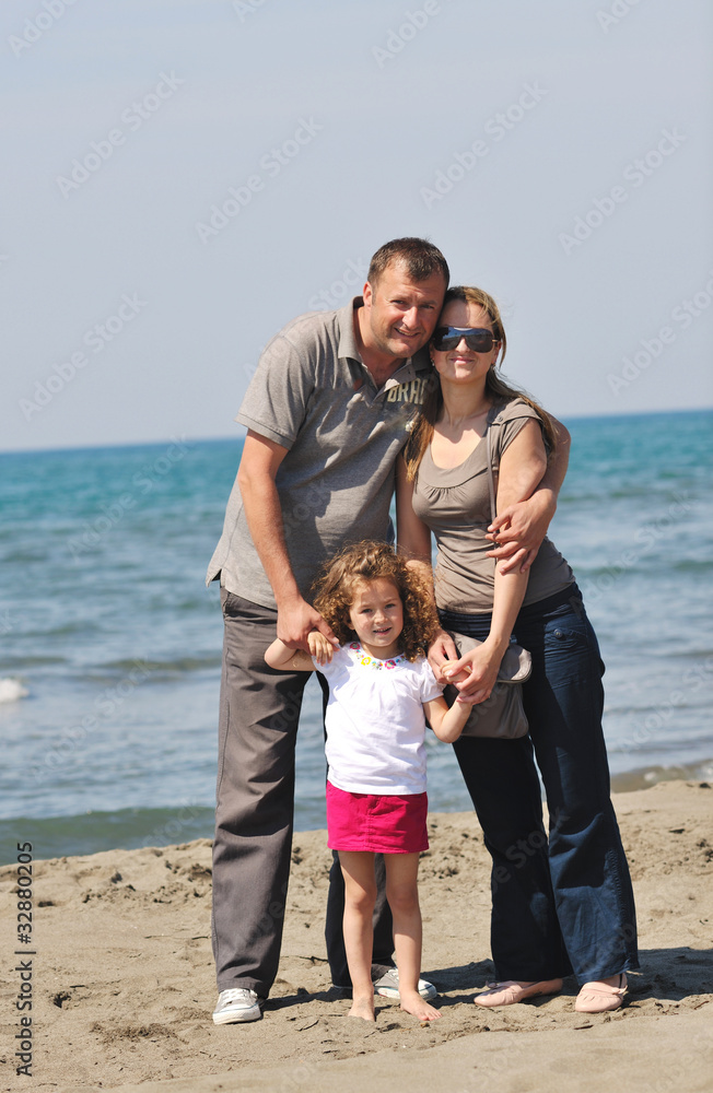 happy young family have fun on beach happy young family have fun on beach