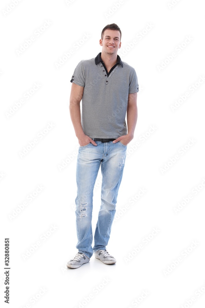 Confident young man in jeans smiling Confident young man in jeans smiling