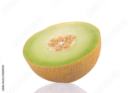 Close-up of melon over white background