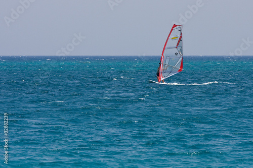 A woman windsurfing on Red Sea