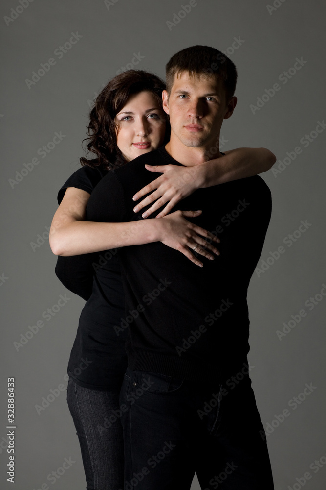 Happy girl hugging a guy Happy girl hugging a guy