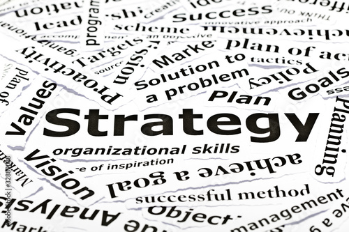 Business strategy concept made with many paper pieces with other printed related words