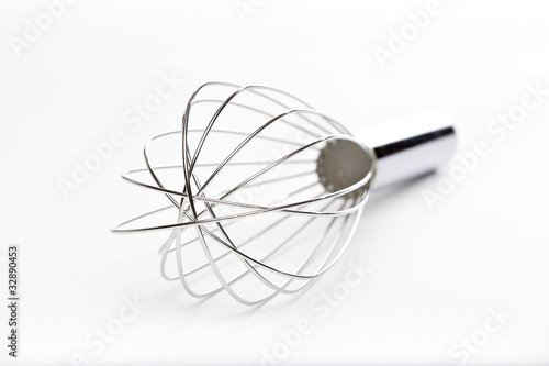 A silver whisk
