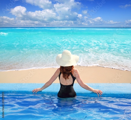 Caribbean sea view from blue pool rear woman © lunamarina