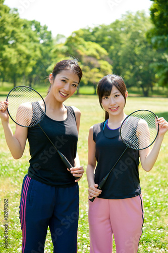 beautiful asian women with racket in the park