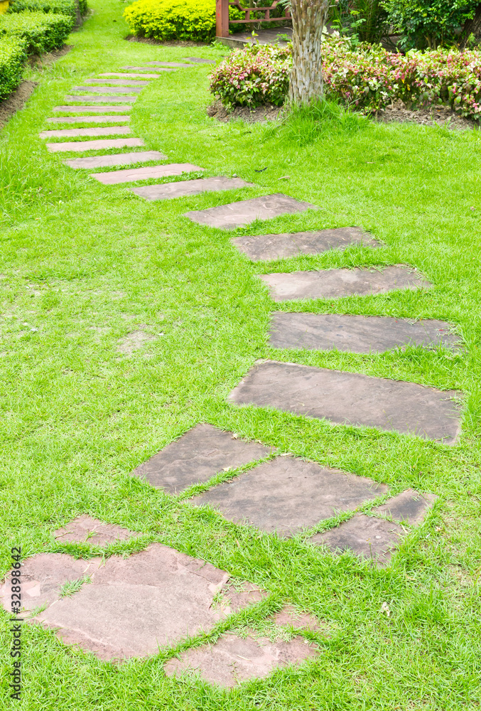 walking stone on green grass walking stone on green grass