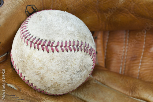 A baseball and baseball glove