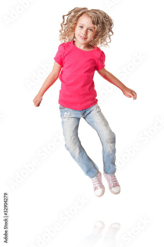 Happy jumping girl with heels together