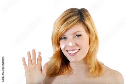 beautiful blond woman with creme (white background)
