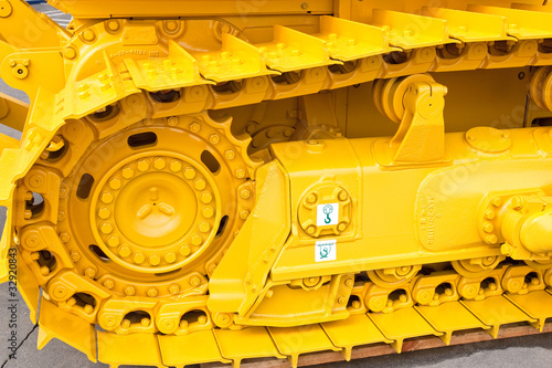 Yellow metall caterpillar band of construction digger
