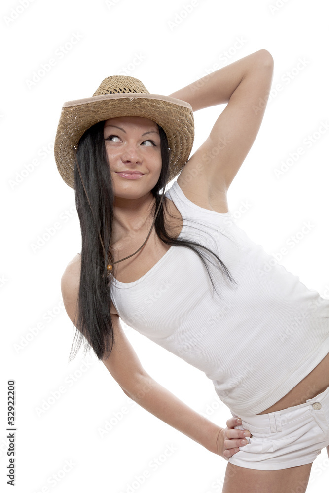 Beautiful brunette with cowboy's hat on head on white background Beautiful brunette with cowboy's hat on head on white background