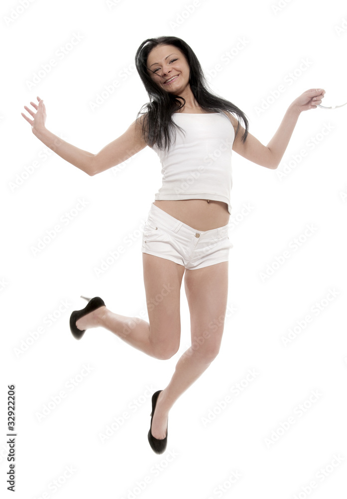 Happy jumping  brunette on white background