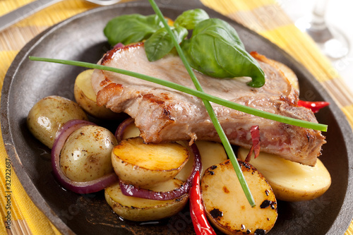 Roasted pork chop and potatoes